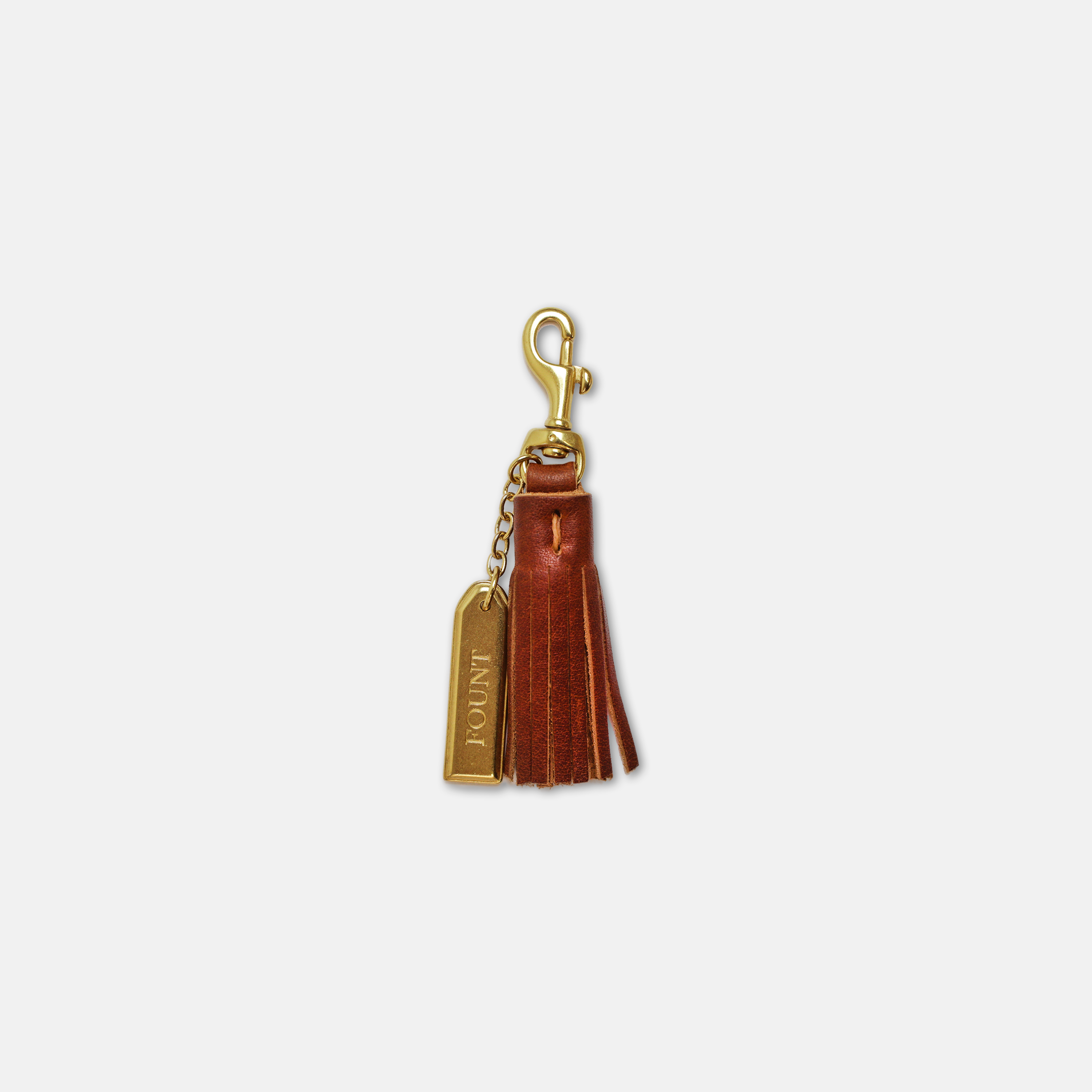 The Petite Tassel Charm